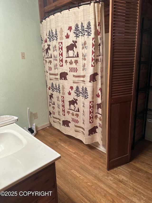 34540 Alamar, Anchor Point, AK 99556 - full bath with wood finished floors, vanity, and a shower with shower curtain