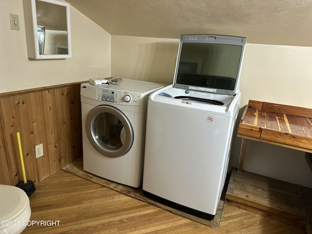 34540 Alamar, Anchor Point, AK 99556 - laundry room with wood finished floors, wainscoting, separate washer and dryer, wooden walls, and a textured ceiling