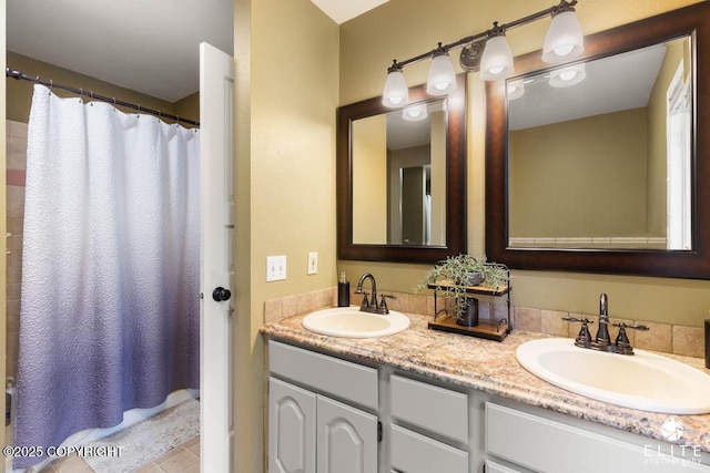 full bath with double vanity, tile patterned flooring, and a shower with curtain