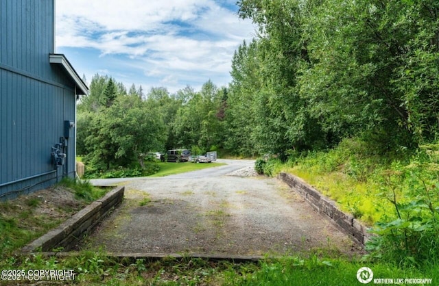 view of street featuring a wooded view