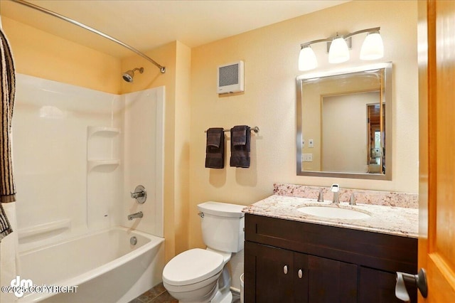 full bathroom with toilet, vanity, and tub / shower combination