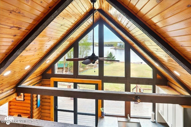 detailed view of wood ceiling, a water view, beam ceiling, and a ceiling fan