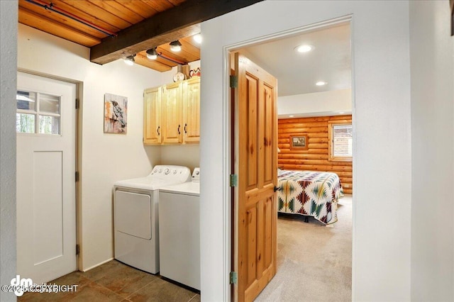 washroom featuring washer and clothes dryer, cabinet space, rustic walls, recessed lighting, and wood ceiling