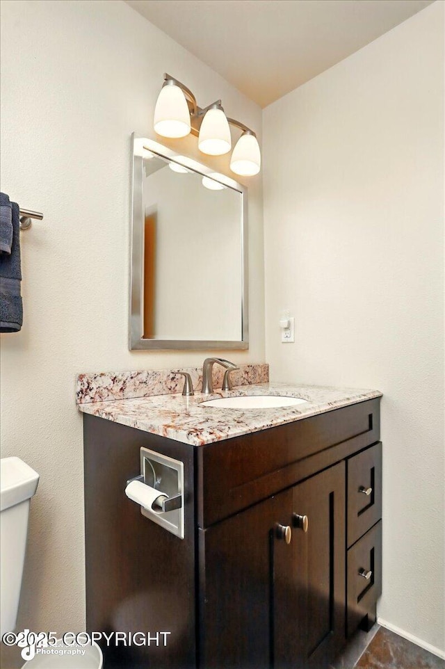 half bath with vanity and toilet