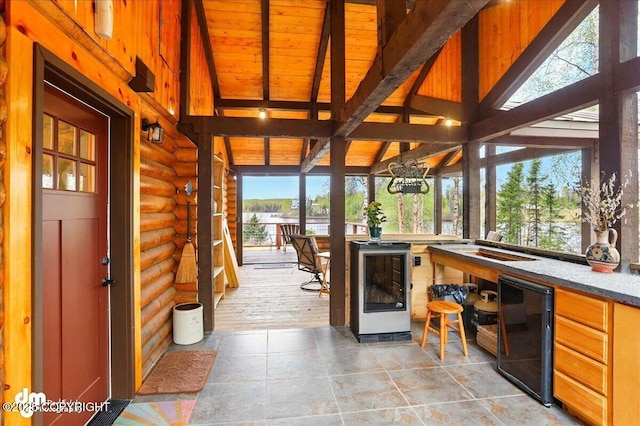 view of patio with wine cooler and a water view