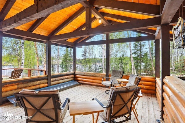 sunroom with view of scattered trees