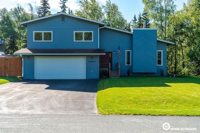 19426 Pribilof Loop, Eagle River, AK 99577 - view of front facade featuring asphalt driveway and an attached garage