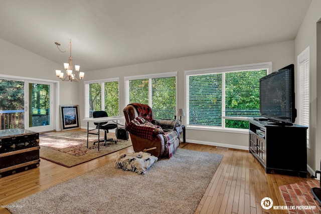 19426 Pribilof Loop, Eagle River, AK 99577 - living room featuring a chandelier, hardwood / wood-style flooring, lofted ceiling, and baseboards