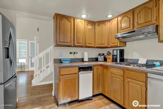 19426 Pribilof Loop, Eagle River, AK 99577 - kitchen featuring stainless steel appliances, under cabinet range hood, light wood-style floors, brown cabinetry, and recessed lighting