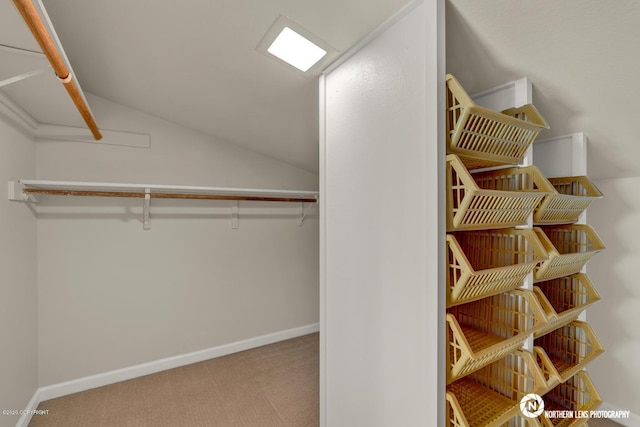 19426 Pribilof Loop, Eagle River, AK 99577 - walk in closet featuring carpet and vaulted ceiling