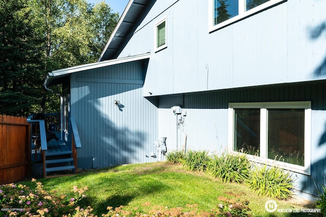 19426 Pribilof Loop, Eagle River, AK 99577 - view of home's exterior featuring a lawn and a wooden deck