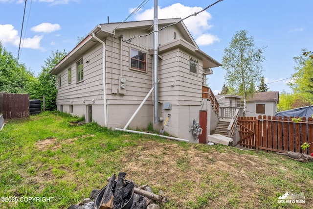 4207 Cope St, Anchorage, AK 99503 - back of house featuring stairway