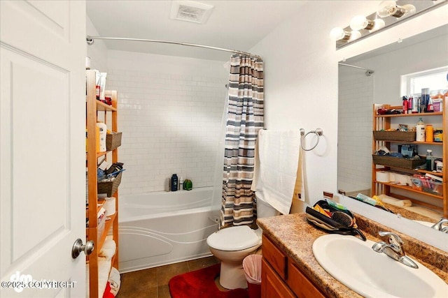 273 S Legacy Loop, Soldotna, AK 99669 - bathroom featuring shower / bath combo with shower curtain, tile patterned floors, toilet, and vanity
