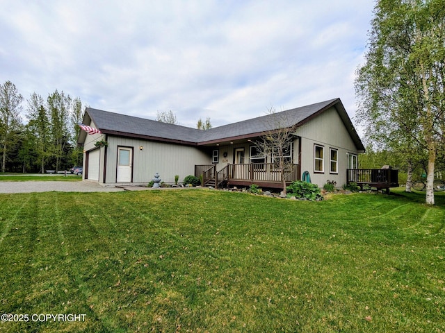 4245 S Trellis Ave, Palmer, AK 99645 - ranch-style house with an attached garage, gravel driveway, a front lawn, and a wooden deck