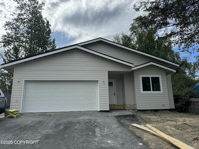 2399 Waldron Dr, Anchorage, AK 99507 - single story home with asphalt driveway and an attached garage
