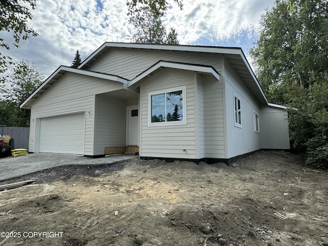 2399 Waldron Dr, Anchorage, AK 99507 - view of front facade with a garage and driveway