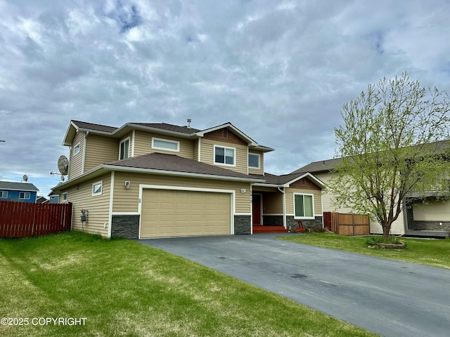 5612 Grand Teton Loop, Anchorage, AK 99502 - view of front facade featuring stone siding, driveway, and a garage