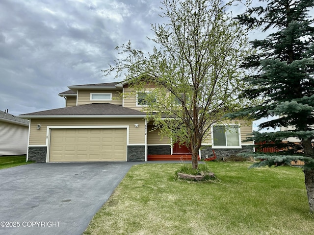 5612 Grand Teton Loop, Anchorage, AK 99502 - view of front of home with stone siding, asphalt driveway, a garage, and a front yard