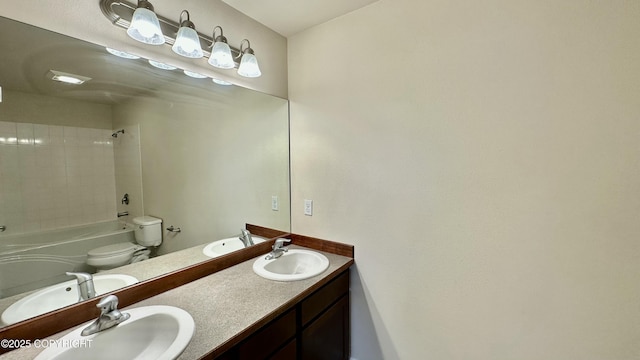 5612 Grand Teton Loop, Anchorage, AK 99502 - full bath featuring toilet, double vanity, and bathing tub / shower combination