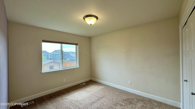 5612 Grand Teton Loop, Anchorage, AK 99502 - carpeted spare room with baseboards