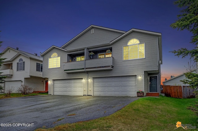 view of front of house with an attached garage and driveway