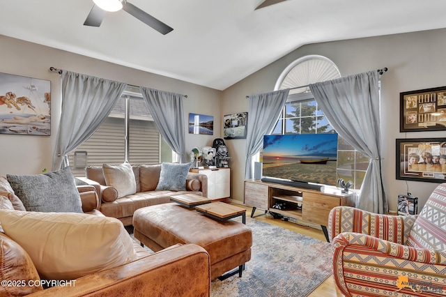 living room with lofted ceiling, a ceiling fan, and wood finished floors