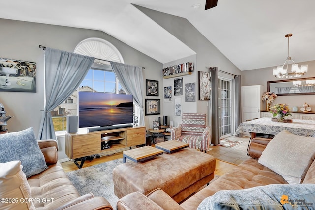 living room with vaulted ceiling and a chandelier