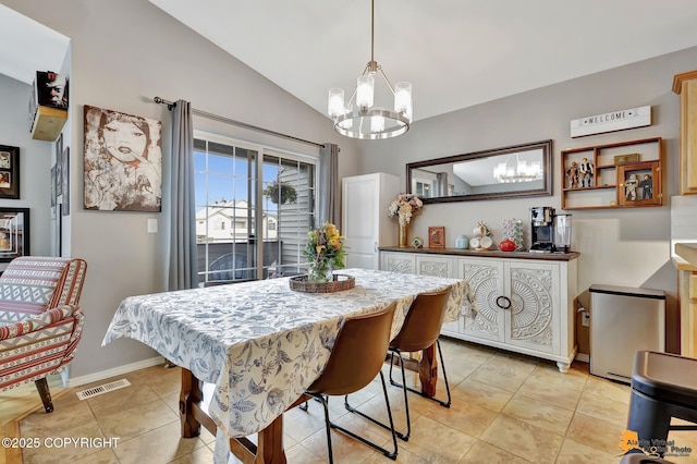 dining area with a chandelier, vaulted ceiling, baseboards, and light tile patterned flooring
