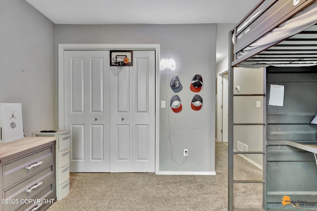unfurnished bedroom with carpet floors and a closet