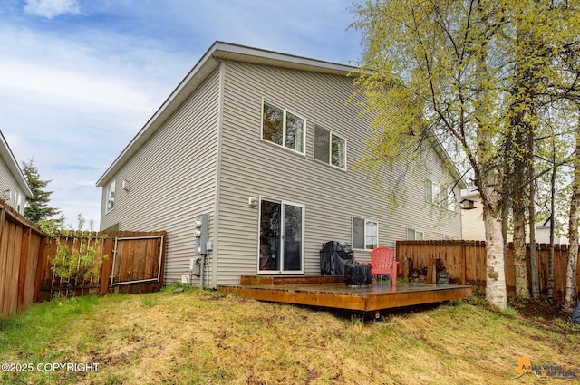 rear view of property with a deck