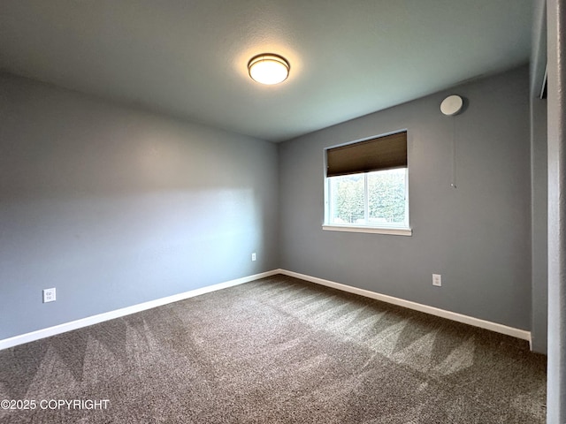 2321 Selief Ln, Kodiak, AK 99615 - empty room featuring dark carpet and baseboards