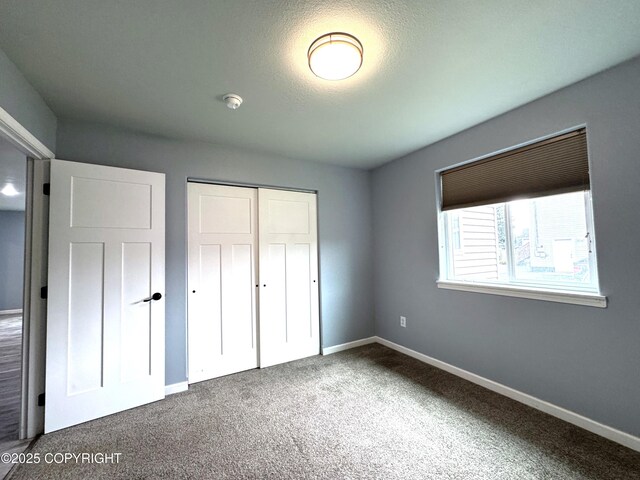2321 Selief Ln, Kodiak, AK 99615 - unfurnished bedroom featuring a closet, carpet, and baseboards