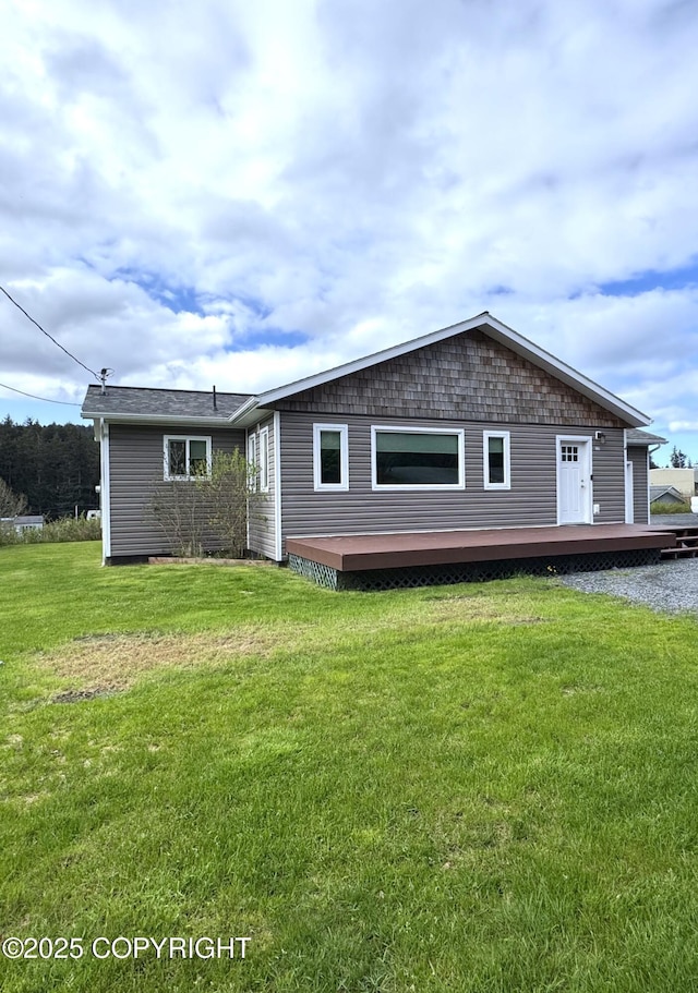 2321 Selief Ln, Kodiak, AK 99615 - back of property with a wooden deck and a lawn