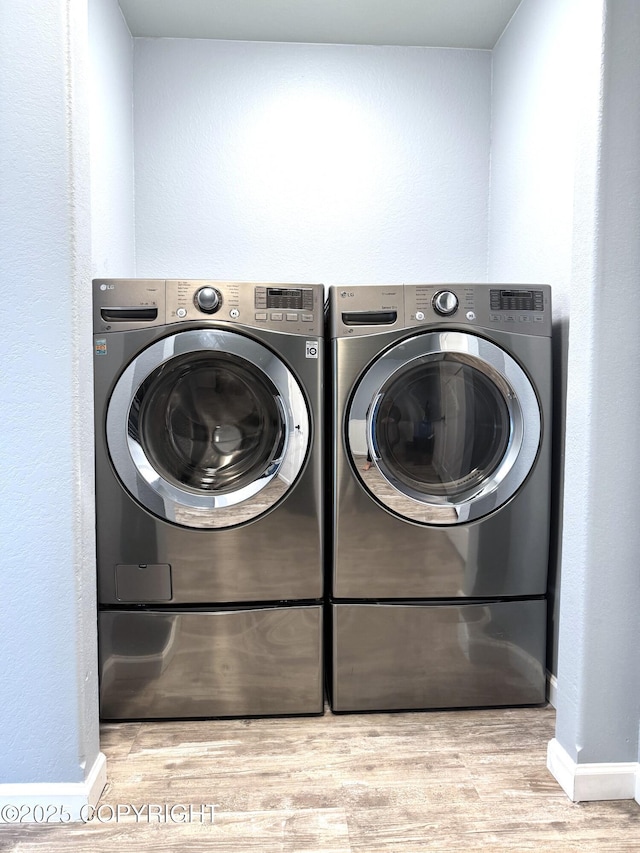2321 Selief Ln, Kodiak, AK 99615 - washroom with washer and clothes dryer, wood finished floors, and baseboards