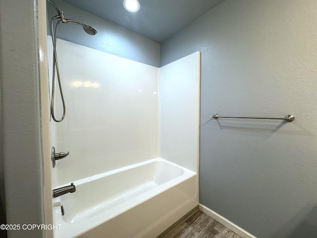 2321 Selief Ln, Kodiak, AK 99615 - bathroom with wood finished floors, baseboards, and shower / washtub combination