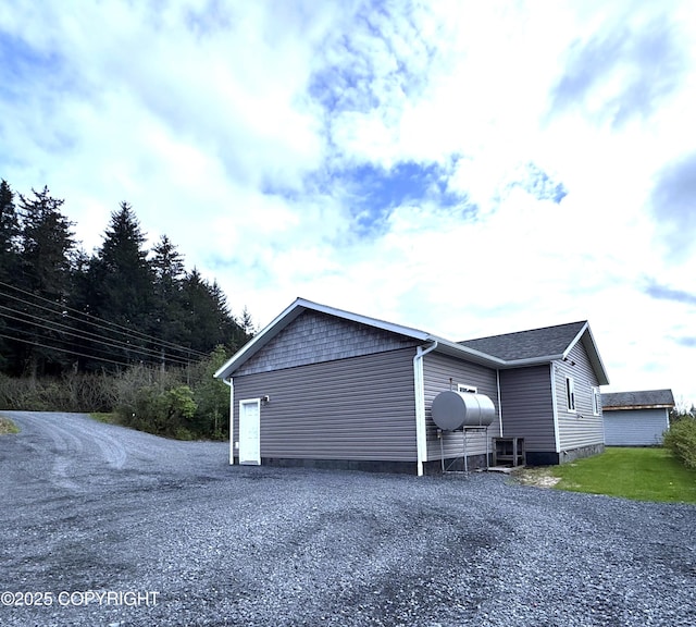 2321 Selief Ln, Kodiak, AK 99615 - view of property exterior with gravel driveway