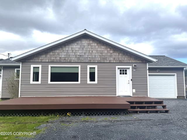 2321 Selief Ln, Kodiak, AK 99615 - view of front of home featuring a wooden deck, an attached garage, asphalt driveway, and a shingled roof