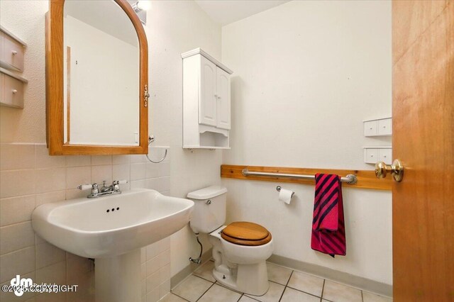21475 Kings River Dr, Sutton, AK 99674 - bathroom featuring tile patterned floors, toilet, and tasteful backsplash