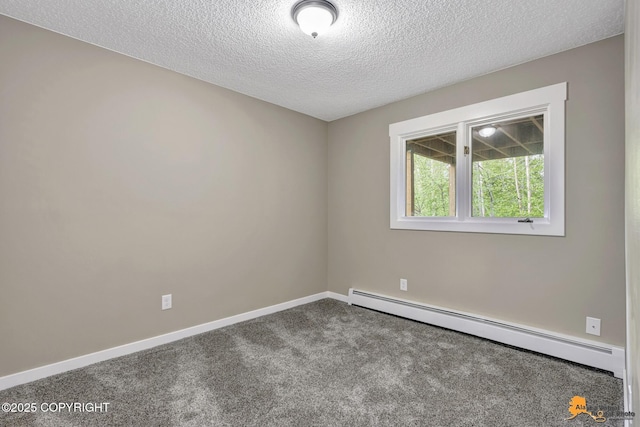 carpeted spare room with baseboard heating, a textured ceiling, and baseboards