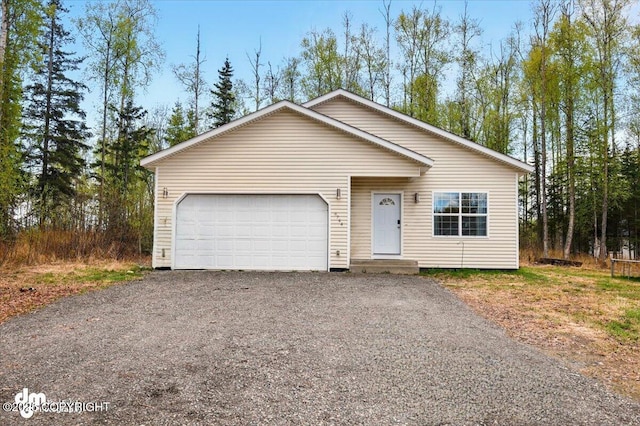 6744 Bogle Bluff Dr, Wasilla, AK 99623 - view of front of property with driveway and a garage