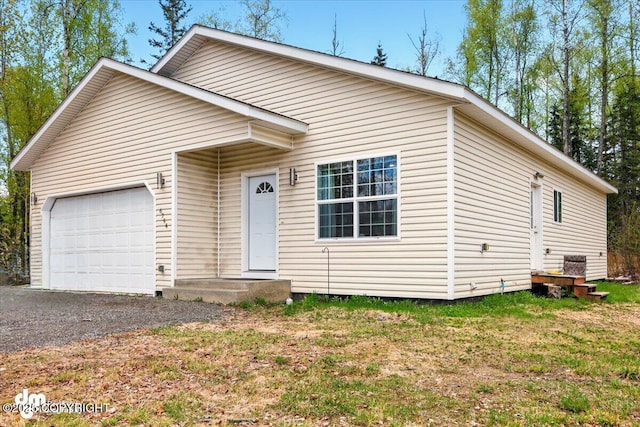6744 Bogle Bluff Dr, Wasilla, AK 99623 - view of front of house with a garage and driveway
