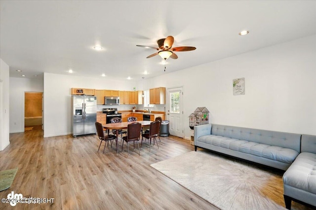 6744 Bogle Bluff Dr, Wasilla, AK 99623 - living area featuring ceiling fan, light wood finished floors, recessed lighting, and baseboards