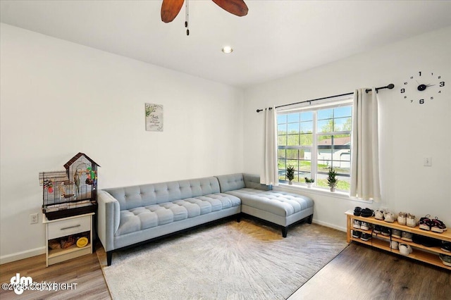 6744 Bogle Bluff Dr, Wasilla, AK 99623 - living room featuring wood finished floors, ceiling fan, and baseboards