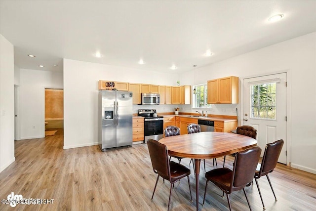 6744 Bogle Bluff Dr, Wasilla, AK 99623 - dining area featuring light wood finished floors, baseboards, and recessed lighting
