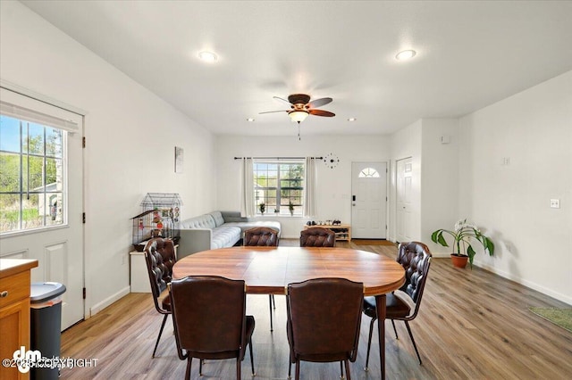 6744 Bogle Bluff Dr, Wasilla, AK 99623 - dining area featuring light wood finished floors, a ceiling fan, baseboards, and recessed lighting