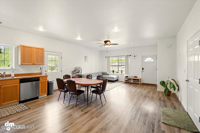 6744 Bogle Bluff Dr, Wasilla, AK 99623 - dining area with light wood-style flooring, a ceiling fan, recessed lighting, and baseboards