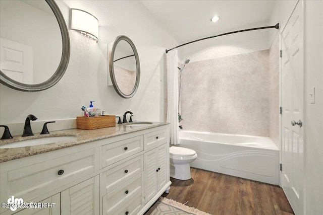 6744 Bogle Bluff Dr, Wasilla, AK 99623 - bathroom featuring shower / bathtub combination with curtain, toilet, wood finished floors, and double vanity