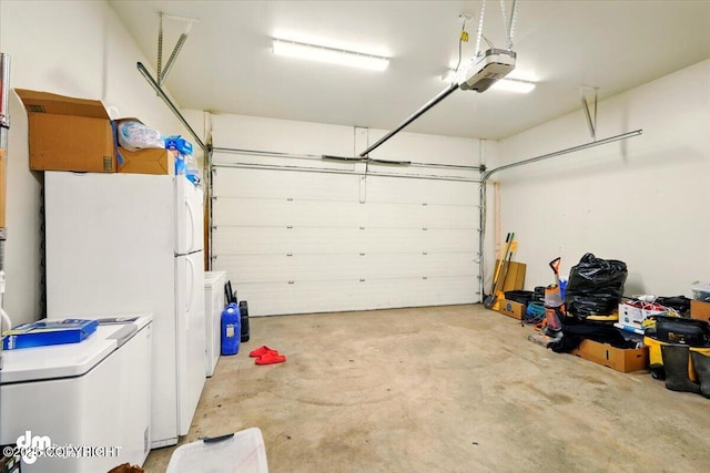 6744 Bogle Bluff Dr, Wasilla, AK 99623 - garage with a garage door opener and freestanding refrigerator