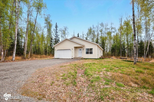 6744 Bogle Bluff Dr, Wasilla, AK 99623 - view of front of home with asphalt driveway and a garage