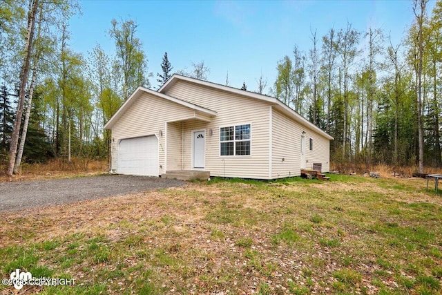 6744 Bogle Bluff Dr, Wasilla, AK 99623 - view of front facade with a garage and driveway
